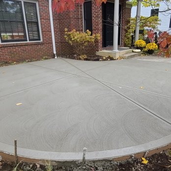 The Concrete Man - Front patio with stress joint cut over gutter drain pipe. - Masonry/Concrete Near Me The Concrete Man - Front patio with stress joint cut over gutter drain pipe. - Masonry/Concrete Near Me