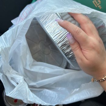 El Rio Grande - a woman's hand holding a purse - Mexican Near Me - Florence, Kentucky