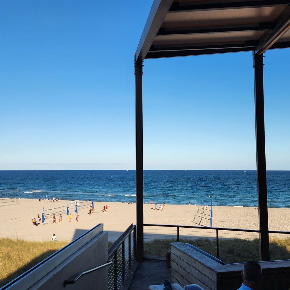 View of the beach from upstairs seating. View of the beach from upstairs seating.