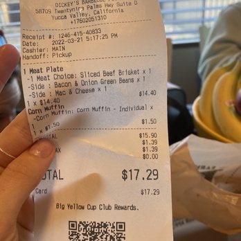 Dickey's Barbecue Pit - a person holding a receipt - Barbeque Near Me - Yucca Valley, California