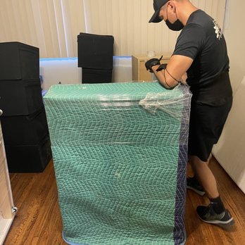 Cozy Moving Solutions - Wrapping the furniture - Movers Near Me