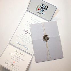 Cotton Ink - Tri fold wedding invitation suite with custom logo, wax seal and string cording wrap.