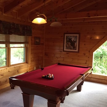 American Patriot Getaways - The pool room upstairs overlooking the living room - Vacation Rentals Near Me - Pigeon Forge, Tennessee