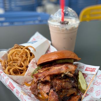 Smashburger - a sandwich and a drink on a table - Burgers Near Me - Manhattan Beach, California Smashburger - a sandwich and a drink on a table - Burgers Near Me - Manhattan Beach, California