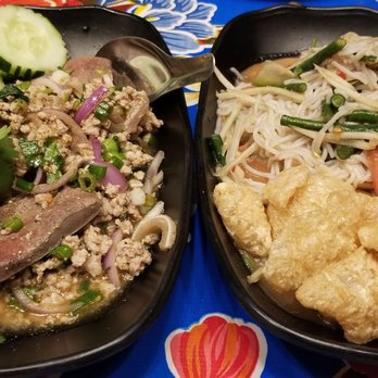 Hug Esan - Pork larb (left) and papaya salad with crispy pork skin - Thai Near Me - Elmhurst, New York Hug Esan - Pork larb (left) and papaya salad with crispy pork skin - Thai Near Me - Elmhurst, New York