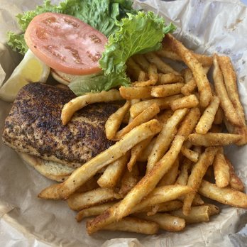 The Boardwalk - Blackened grouper sandwich with fries - Seafood Near Me - Put In Bay, Ohio The Boardwalk - Blackened grouper sandwich with fries - Seafood Near Me - Put In Bay, Ohio