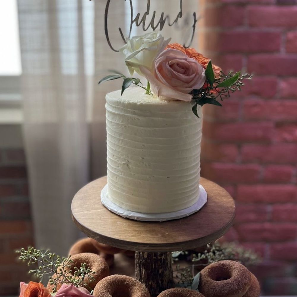 a wedding cake and donuts a wedding cake and donuts