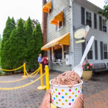 Gil & Bert's Ice Cream - a hand holding a cup of ice cream - Ice Cream & Frozen Yogurt Near Me - Cranbury, New Jersey