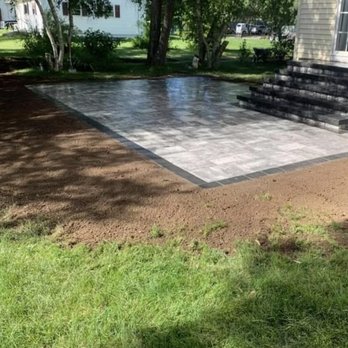 E & V Landscaping Construction - a concrete patio being installed - Landscaping Near Me