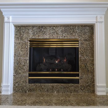 One up construction - a fireplace in a home - General Contractors Near Me