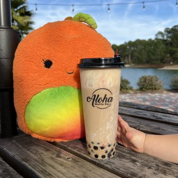 Aloha Waffle Bar - The baby arm trying to sneak in and take the seasonal bubble tea with peppermint. - Coffee & Tea Near Me - Jacksonville, Florida