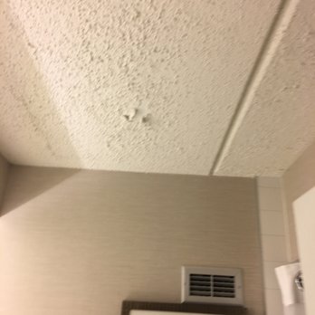 Hilton Albany - Look at this... peeling chips from the ceiling of our bathroom. - Hotels Near Me - Albany, New York Hilton Albany - Look at this... peeling chips from the ceiling of our bathroom. - Hotels Near Me - Albany, New York