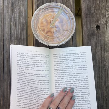 Black Dog Cafe - Iced Latte with Peppermint syrup in an ~aesthetic~ shot with the book I read during my last visit! - Coffee & Tea Near Me - Tallahassee, Florida