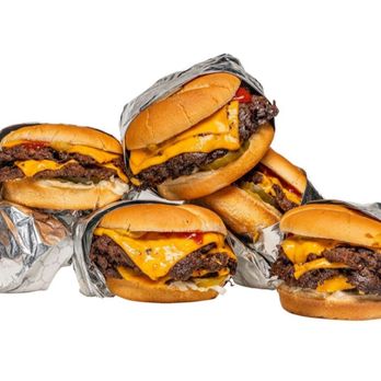 MrBeast Burger - a pile of cheeseburgers - Food Delivery Services Near Me - Great Neck, New York