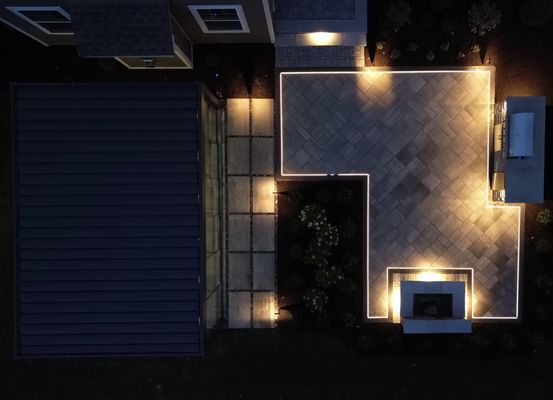 Modern Paver Patio + Pergola – Libertyville, IL - A modern outdoor living space designed for evenings outside.
This custom paver patio features integrated LED trim lighting, a built-in grill island, seating wall, and a glass-enclosed Pergolux Skydance S3 pergola for year-round comfort. Clean geometry, soft landscape accents, and layered lighting create a warm, modern atmosphere long after sunset. Modern Paver Patio + Pergola – Libertyville, IL - A modern outdoor living space designed for evenings outside.
This custom paver patio features integrated LED trim lighting, a built-in grill island, seating wall, and a glass-enclosed Pergolux Skydance S3 pergola for year-round comfort. Clean geometry, soft landscape accents, and layered lighting create a warm, modern atmosphere long after sunset.