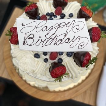 Konditor Meister - a birthday cake with strawberries and blueberries - Bakeries Near Me - Braintree, Massachusetts