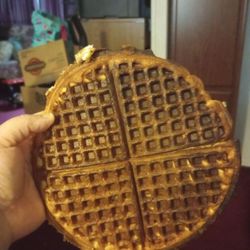 Waffle House - Holding up the burnt waffle