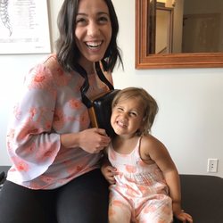 Root & Bloom Chiropractic - My toddler making a "phone call" to get adjusted
