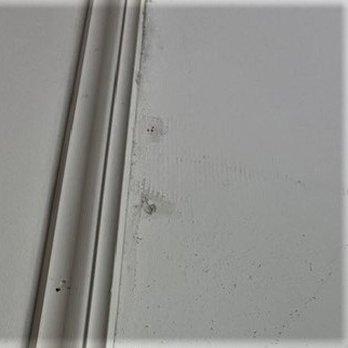 Northland Handyman Services - Two of many nail holes still visible + sloppy paint job @ trim - Handyman Near Me