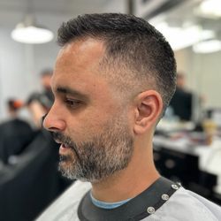 Master Barbers - Mid Skin Fade with Comb Over Haircut Service By Lloyd Guerrero. Book Us Today!