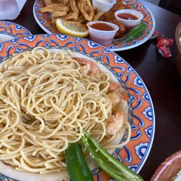 a plate of pasta with shrimp a plate of pasta with shrimp