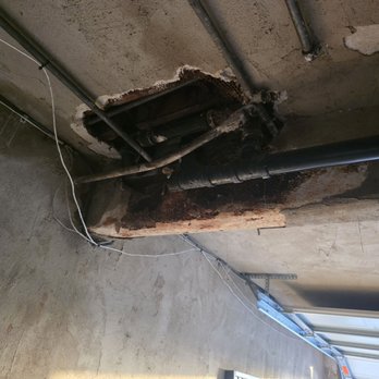 Beach Front Property Management - These are the holes in my garage and the sewage in the other tenants tub. - Property Management Near Me - Long Beach, California Beach Front Property Management - These are the holes in my garage and the sewage in the other tenants tub. - Property Management Near Me - Long Beach, California