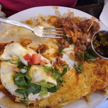Hannah And Nate's - Huevos Rancheros- 2 over med eggs, 2 corn tortillas, cheese, lettuce, tomatoes, side of beans, hashbrowns, and a tortilla red on top - Cafes Near Me - Corrales, New Mexico Hannah And Nate's - Huevos Rancheros- 2 over med eggs, 2 corn tortillas, cheese, lettuce, tomatoes, side of beans, hashbrowns, and a tortilla red on top - Cafes Near Me - Corrales, New Mexico