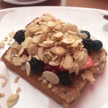 Catrina Café - Fresh berry toast homemade white bread with almond butter peach glaze fresh berries and slivered sugared almonds. Yum - Breakfast & Brunch Near Me - Seal Beach, California