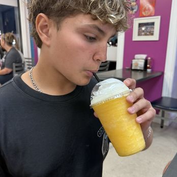 Dolce Crema Cafe - Whipped cream served on top of the delicious mango smoothie! - Desserts Near Me - Old Orchard Beach, Maine