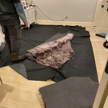 Rockwell Property - maintenance trashing the rug that got flooded with mold and feces - Property Management Near Me - Chicago, Illinois