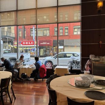 Chef Yu - people sitting at tables in a restaurant - Szechuan Near Me - New York, New York Chef Yu - people sitting at tables in a restaurant - Szechuan Near Me - New York, New York