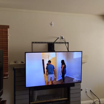 TheTvHangman - Fireplace mount bring it down for lower viewing, back up when not in use. - Home Theatre Installation Near Me
