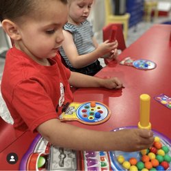Popcorn Poppin Preschool - We love using Lakeshore Games. This game has wonderful fine motor, color recognition, taking turns, and playing together.