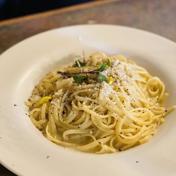 Pizzaioli - a plate of pasta with parmesan cheese - Italian Near Me - Chino, California Pizzaioli - a plate of pasta with parmesan cheese - Italian Near Me - Chino, California