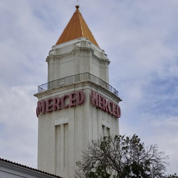 Merced Theatre - a tall tower with a clock on top - Performing Arts Near Me - Merced, California