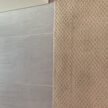 Moser Carpet Repairs - after 2: ramp is handled properly to match the tile's height (foot won't hit the tiles) - Carpeting Near Me