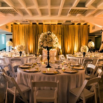 International Flowers - We liked the idea of the high and low centerpieces; Homa sprayed our low centerpieces black..they were clear in the beginning! Love her! - Florists Near Me - Los Angeles, California