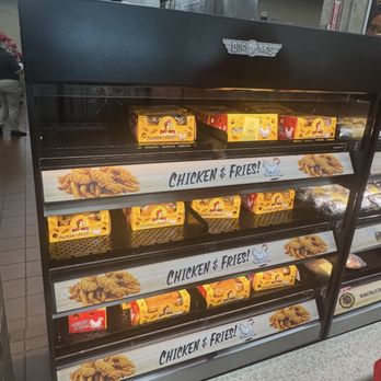Buc-ee’s - Display shelves at Buc-ee's in Saint Augustine, FL, stocked with frozen chicken and fries food boxes, with signage reading 'Chicken & Fries!'. - Gas Stations Near Me - Saint Augustine, Florida