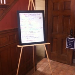 Dhanwantari Yoga Center - When you enter, you will see a list of class times for the month. Yoga is down the stairs!
