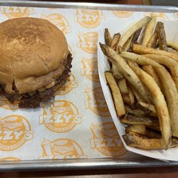 Izzy’s Burgers and Shakes - Izzy's Smash Cheeseburger w/ Grilled Onions on a gluten free bun and fries