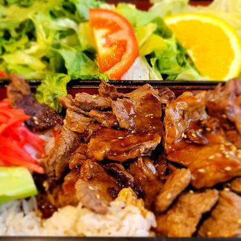 Sushi West - a close up of a bento box of food - Sushi Bars Near Me - Long Beach, California