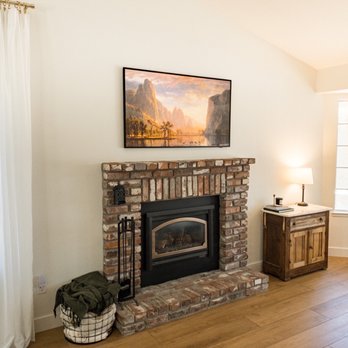 JC Smart Homes & Security Cameras - Samsung Frame TV mounted above a fireplace. - Home Automation Near Me JC Smart Homes & Security Cameras - Samsung Frame TV mounted above a fireplace. - Home Automation Near Me