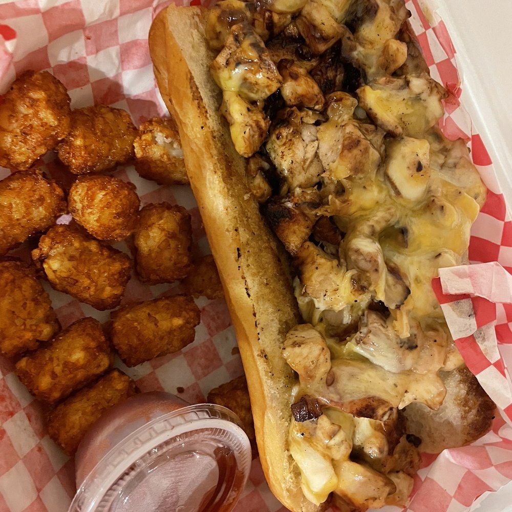 Landing Zone - Chicken Philly Cheesesteak (asked for no veggies) with Tater Tots. Ate some tots pre-photo and there's more under the sandwich. - Sports Bars Near Me - Oklahoma City, Oklahoma Landing Zone - Chicken Philly Cheesesteak (asked for no veggies) with Tater Tots. Ate some tots pre-photo and there's more under the sandwich. - Sports Bars Near Me - Oklahoma City, Oklahoma