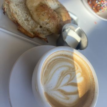 Sapor Coffee & Concepts - Rosemary Sea Salt Bagel and Cappuccino - Coffee & Tea Near Me - Denver, Colorado Sapor Coffee & Concepts - Rosemary Sea Salt Bagel and Cappuccino - Coffee & Tea Near Me - Denver, Colorado