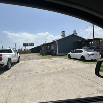 Pier 77 - The run side view, no bay, just an unkept parking lot. - Seafood Near Me - Fulton, Texas
