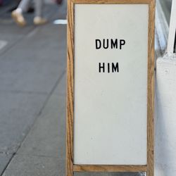 Reformation - Dump Him sidewalk sign