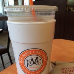  a drink in a plastic cup with a straw