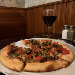 Our cheese free veggie pizza and glass of house red wine. (Can't beat their prices for their house red!)