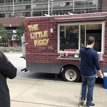 The Little Piggy - a man standing in front of a food truck - Food Trucks Near Me