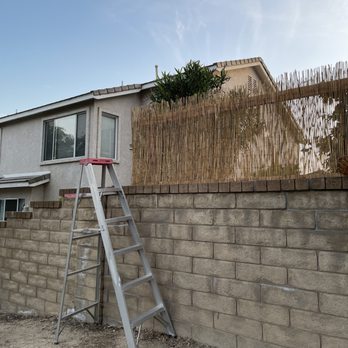 Barrett's Handyman Services - Adding a bamboo privacy fence for client. Added 3 feet to his wall. - Handyman Near Me Barrett's Handyman Services - Adding a bamboo privacy fence for client. Added 3 feet to his wall. - Handyman Near Me